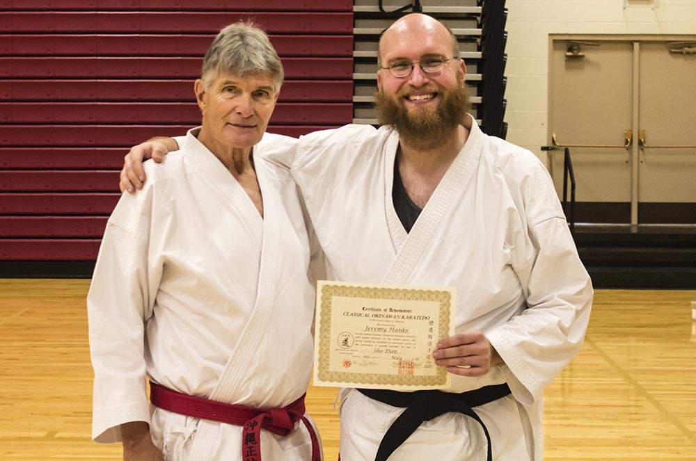 Sensei Hanke (Right) Receiving 1st Degree Certification From Hanshi Mack (Left).